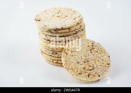 Thin corn cakes with sesame. Healthy food nutrition. Thin round corn cakes. Stack of puffed rice snack Stock Photo