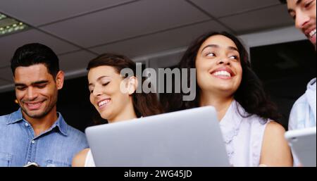 Diverse young professionals in an office setting Stock Photo