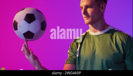 Image of caucasian male soccer player over confetti Stock Photo