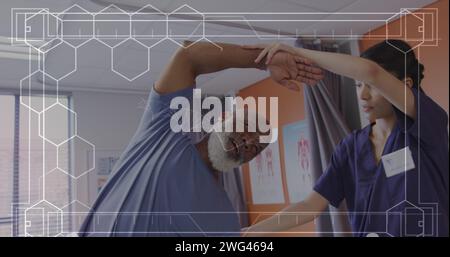 Image of dna strand over biracial female doctor with male patient Stock Photo