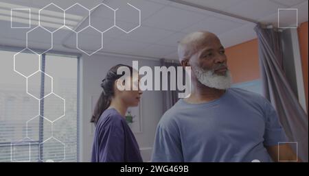 Image of dna strand over biracial female doctor with male patient Stock Photo