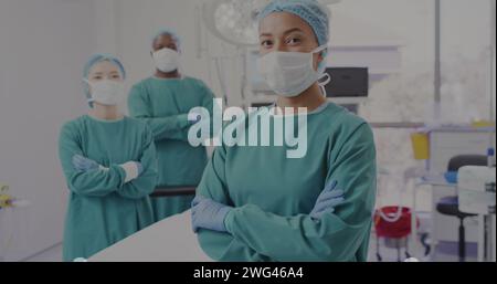 Image of dna strand and numbers over diverse surgeons Stock Photo