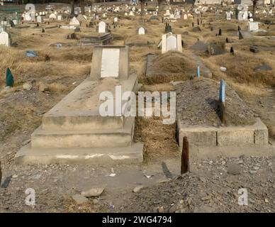 Gravestones and graves at Muslim cemetery in Pakistan Stock Photo