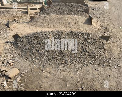 Muslims graves in cemetery closeup. End of life. Stock Photo