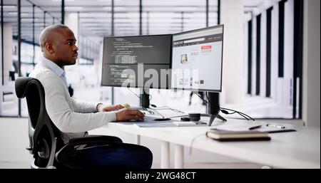 African Web Developer Programming Online Shop In Office Stock Photo