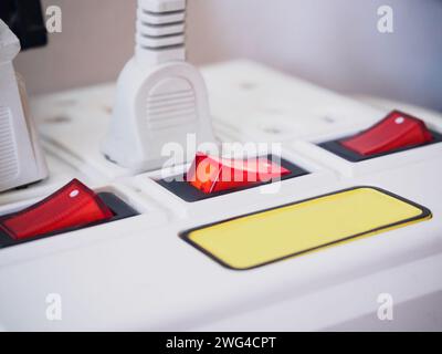 Multiple power socket with connected plugs Stock Photo