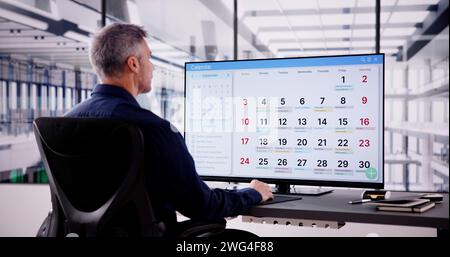 Appointment Schedule Planner And Date Calendar On Hybrid Laptop Stock Photo