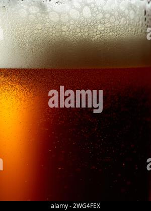 Glass of beer with foam, close-up. Macro shot. Stock Photo