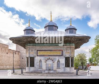 Fountain of Sultan Ahmed III, aka Ahmet Cesmesi, a 17th century public Turkish rococo water fountain, or Sabil, located in the Great Square, near the Imperial Gate of Topkapi Palace, Istanbul, Turkey Stock Photo