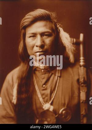 Tah It Way, c1905. Tah It Way, head-and-shoulders portrait, facing front, peace pipe on right. Stock Photo