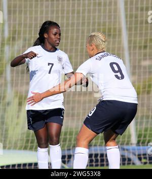 Women's Friendly International: England v Norway, La Manga, Spain, 17 January 2014. Chelsea's Eniola Aluko celebrates scoring England's goal with Lianne Sanderson  in their 1-1 under new Manager Mark Sampson Photograph by Tony Henshaw Stock Photo