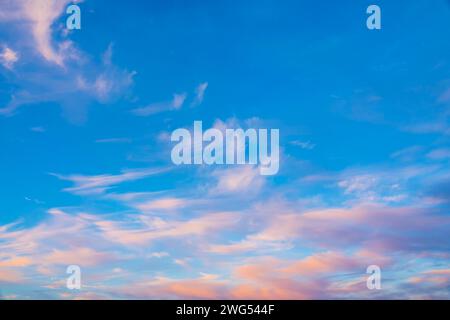 Beatiful sunset sky with pink cirrus clouds background. Stock Photo