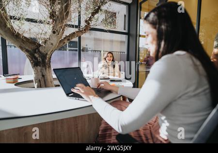 Business colleagues collaborating on analyzing market data for new project in a creative office Stock Photo