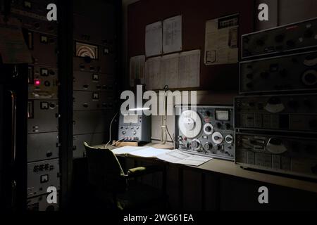 vintage control room or telecommunications desk MOD hack green secret bunker cheshire, used in cold war nuclear blast shelter, command post Stock Photo