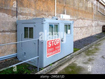 grey steel military security checkpoint building & stop sign MOD hack green secret bunker cheshire, command post now a muse Stock Photo