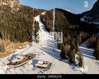Civetta resort. Panoramic view of the Dolomites mountains in winter, Italy. Ski resort in Dolomites, Italy. Aerial  drone view of ski slopes and mount Stock Photo