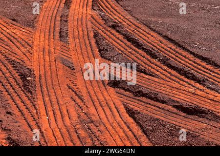Truck tire tracks on red earth Stock Photo