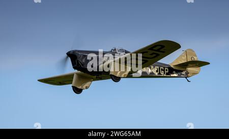 old Warden, UK - 2nd October 2022:  Vintage aircraft 1930's Miles Hawk Speed Six  flying close to the ground Stock Photo