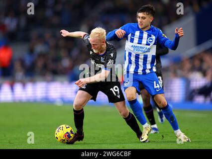 Crystal Palace's Will Hughes (left) and Brighton and Hove Albion's Facundo Buonanotte battle for the ball during the Premier League match at the American Express Stadium, Brighton. Picture date: Saturday February 3, 2024. Stock Photo