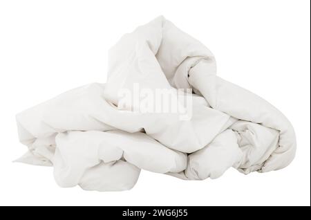 White crumpled blanket in hotel room leaved untidy after guest's use over night is isolated on white background with clipping path. Stock Photo