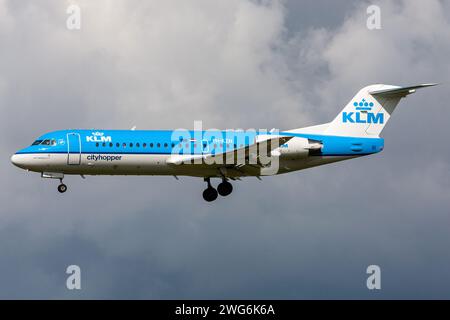 Dutch KLM Cityhopper Fokker 70 with registration PH-KZN on final for Amsterdam Airport Schiphol Stock Photo