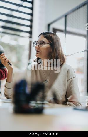 Professionals collaborate in a modern office, focusing on market analysis, strategic planning for sustainable business growth. Stock Photo