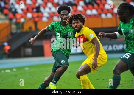 ABIDJAN, COTE D'IVOiRE - FEBRUARY 2; Ola Aina of Nigeria and Corte Real Carneiro Augusto De Jesus of Angola during the TotalEnergies Caf Africa Cup of Stock Photo