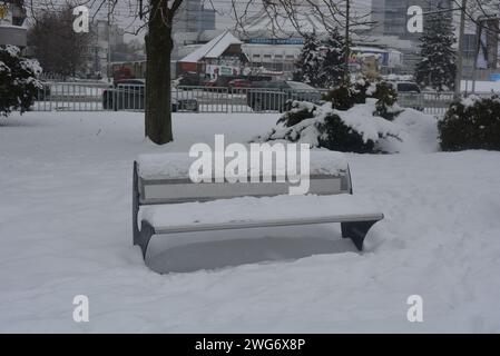 On the embankment of the river Dnipro there is a metal shop with snow and snow, in winter in cold weather. Stock Photo