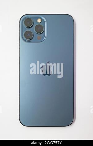 Itterbeck, Germany - Feb 2 2024 A pacific blue Iphone 12 Pro Max isolated on a white background Stock Photo