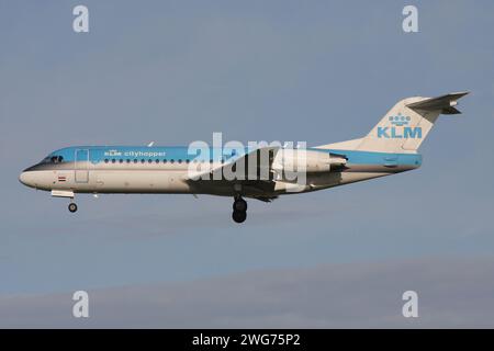 Dutch KLM Cityhopper Fokker 70 with registration PH-KZG on final for Amsterdam Airport Schiphol Stock Photo