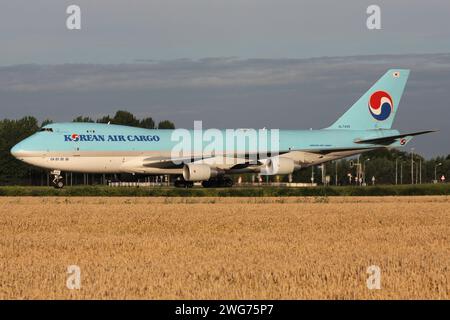 Korean Air Cargo Boeing 747-400F with registration HL7499 rolling on taxiway V of Amsterdam Airport Schiphol Stock Photo