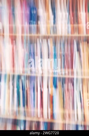 Motion blurred rows of books, abstract background. Stock Photo