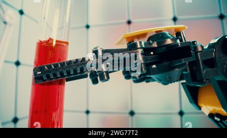 a robot holds a sample of a chemical substance the concept of using robotics in laboratory work Stock Photo