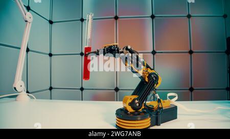 a robot holds a sample of a chemical substance the concept of using robotics in laboratory work Stock Photo