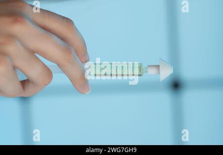 girl holding a syringe with intranasal medicine in her hand Stock Photo