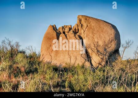 A huge. boulder that resembles a cracked egg lies on the ground on the Baja California desert near Tecate. Stock Photo