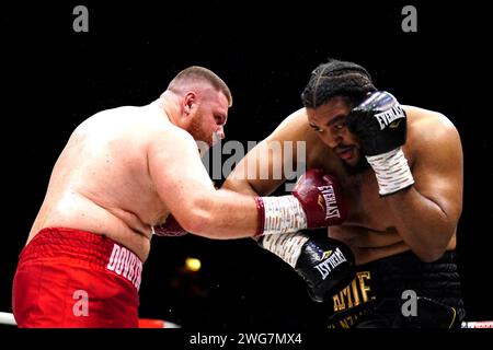 Kostiantyn Dovbyshchenko (left) in action against Jeamie 'TKV' Tshikeva in the Heavyweight bout at the OVO Arena Wembley, London. Picture date: Saturday February 3, 2024. Stock Photo