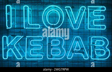 Neon shining sign in blue color on a brick wall with the inscription or slogan I love kebab. Brick wall, background. Bright electric neon light. Cafe- Stock Photo