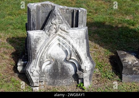 An old broken tombstone in a graveyard, Rawdon,Quebec,Canada Stock Photo