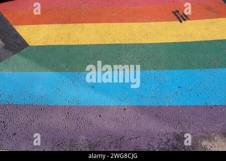 The LGBTQ signis painted in the steet. Stock Photo
