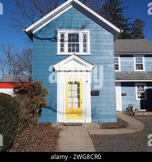 The blue house with a yellow door. Stock Photo