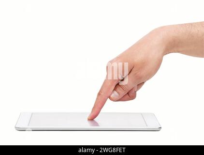Cropped closeup of a man's hand above a digital tableton and a white isolated background Stock Photo