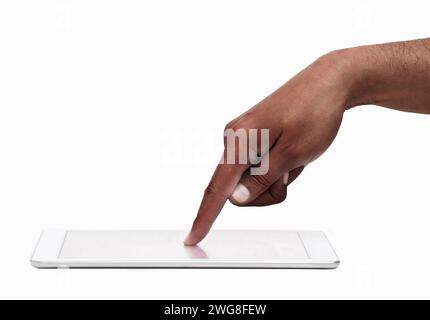 Cropped closeup of a man's hand above a digital tableton and a white isolated background Stock Photo