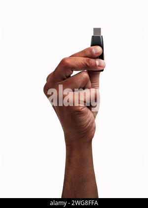 Cropped shot of an unrecognizable man hand showing a pen drive isolated on a white background Stock Photo