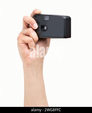 Man hand holding a compact camera isolated on a white background Stock Photo