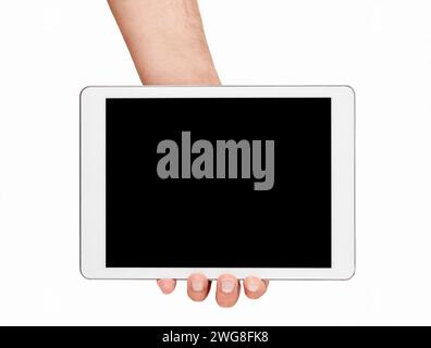 Man hands showing a digital tablet in a white isolated background Stock Photo