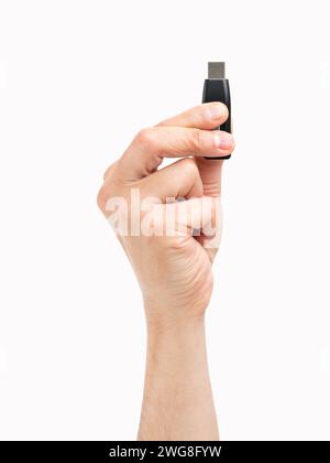Cropped shot of an unrecognizable man hand showing a pen drive isolated on a white background Stock Photo