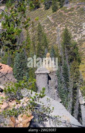 Mushroom shaped formation sits on cliff at Pinnacles Overlook, in Crater Lake National Park, in Oregon. Stock Photo