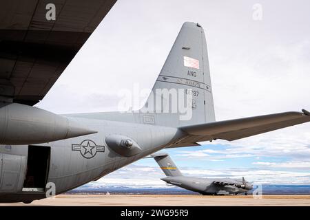 A U.S. Air Force C-130H Hercules aircraft, assigned to the 180th Airlift Squadron, Missouri Air National Guard and a C-17 Globemaster III aircraft, with the 97th Air Mobility Wing, set on the flight line at Fort Huachuca, Arizona, during Winter Training at the Advanced Tactics Training Center, January 23, 2024. Winter Training is a break from the regular course schedule where the instructors of AATTC tweak the training scenarios for the coming year and perform them, with the help of guest units, to keep their skills fresh.  Since 1983 the AATTC has provided advanced tactical training to mobili Stock Photo