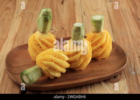 Ripe Peeled Pineapple on Wooden Table, Ready to Eat Stock Photo